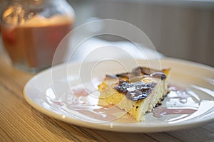 Cottage cheese casserole stands on a wooden table close up