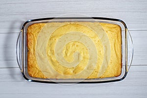 Cottage cheese casserole on a white table. Top view