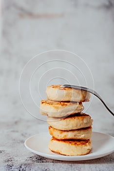 Cottage cheese cheesecakes on a wooden board