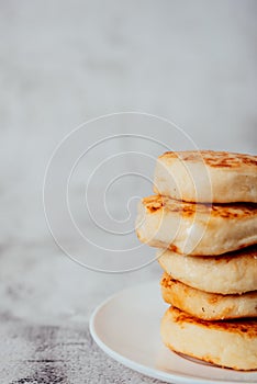 Cottage cheese cheesecakes on a wooden board