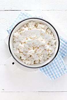 Cottage cheese, curd on white wooden rustic table