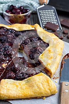 Cottage cheese dough galette with cherries and chocolate, vertical