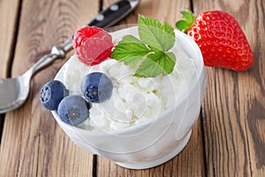Cottage cheese and fruits photo
