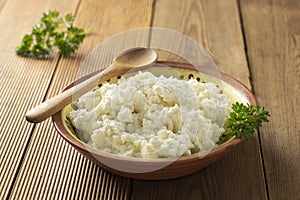 Cottage cheese isoalted on wooden background. Dairy products, calcium and protein. Healthy breakfast