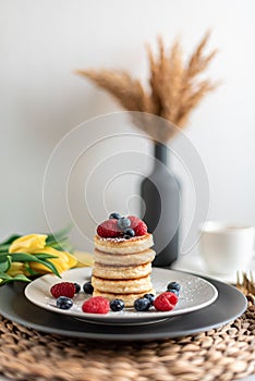 Cottage cheese pancakes with berries, healthy breakfast