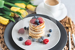 Cottage cheese pancakes with berries, healthy breakfast