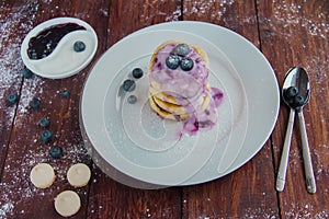 Cottage cheese pancakes with blueberry jam photo