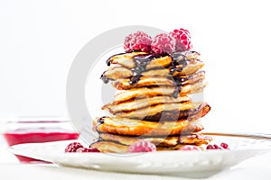 Cottage cheese pancakes with fresh raspberry and chocolate sirup