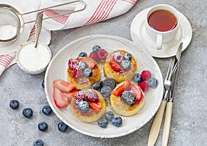 Cottage cheese pancakes, syrniki, curd fritters with fresh berries