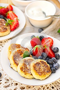Cottage cheese quark pancakes syrniki with fresh berries