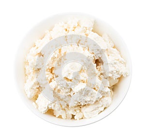 Cottage cheese in white bowl isolated on a white background, top