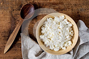 Cottage cheese in wooden bowl