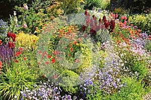 Cottage garden in Great Dixter House & Gardens in the summer.