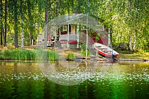 Cottage by the lake in rural Finland photo