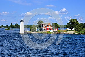 Cottage with lighthouse, Thousand Islands, New York state, USA