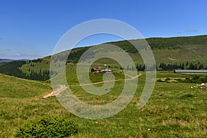 Cottage and ranch in the Rodnei mountains on plateau photo