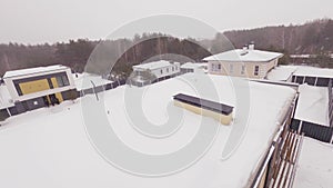 Cottage residential area covered with snow in winter