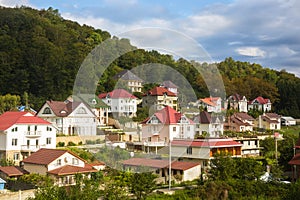 Cottage settlement on slope of low mountain