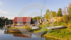 Cottage and ships on the island Harstena in Sweden