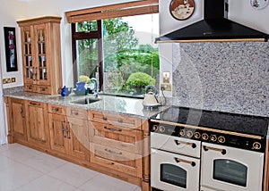 Cottage style kitchen in wooden finish and granite worktop
