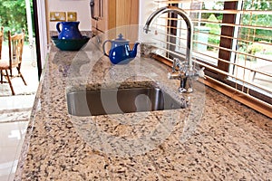 Cottage style kitchen in wooden finish and granite worktop