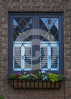 Cottage style window with flowers ouside