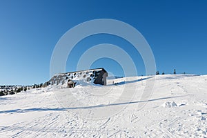 Cottage Vyrovka, cottage covered by snow, height quota 1356 m, krkonose mountains Czech Republic