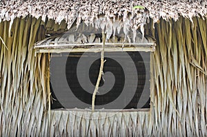 Cottage window made of coconut leaves.