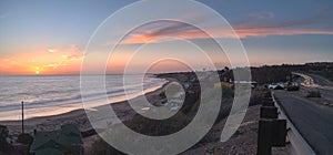 Cottages along Crystal Cove Beach at sunset