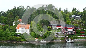 Cottages on the shore. Sweden. Amazing Swedish Wooden Log Cabin House On Rocky Island. Beautiful homes and vacation