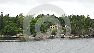 Cottages on the shore. Sweden. Amazing Swedish Wooden Log Cabin House On Rocky Island. Beautiful homes and vacation