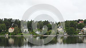 Cottages on the shore. Sweden. Amazing Swedish Wooden Log Cabin House On Rocky Island. Beautiful homes and vacation