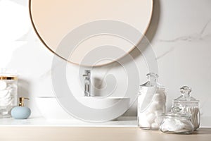 Cotton balls, swabs and pads on wooden table