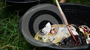 Cotton being dyed manually in process of making Indonesian Batik