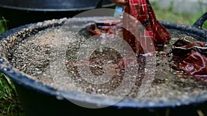 Cotton being dyed manually in process of making Indonesian Batik