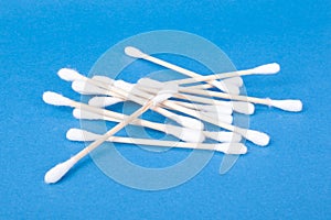 Cotton buds for cleaning auricles on blue background