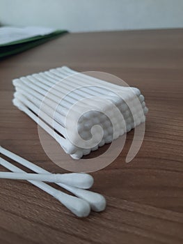 cotton buds on table wood