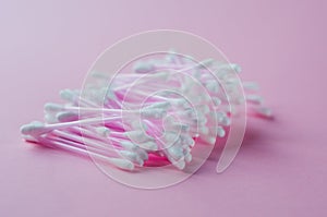 Cotton buds for medical on color background. Round container with cotton buds