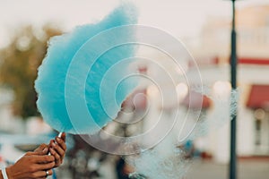 Cotton Candy floss machine making blue candyfloss outdoor