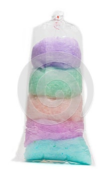 Cotton candy in plastic bag isolated on white background