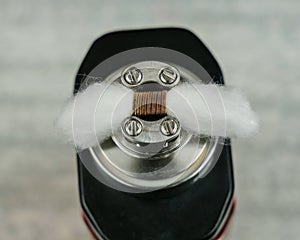 Cotton in coil, in the atomizer for vaping