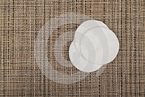 Cotton Disks, Hygiene Pads on Eco Linen Background, Round Facial Sponge, Soft Clear Disk Stack