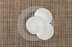 Cotton Disks, Hygiene Pads on Eco Linen Background, Round Facial Sponge, Soft Clear Disk Stack