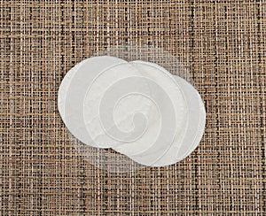 Cotton Disks, Hygiene Pads on Eco Linen Background, Round Facial Sponge, Soft Clear Disk Stack