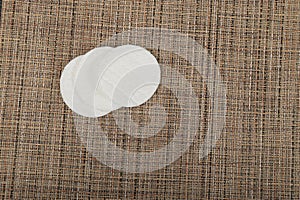 Cotton Disks, Hygiene Pads on Eco Linen Background, Round Facial Sponge, Soft Clear Disk Stack
