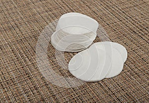 Cotton Disks, Hygiene Pads on Eco Linen Background, Round Facial Sponge, Soft Clear Disk Stack