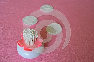cotton ear swabs, pads. Personal hygienic. Pink background