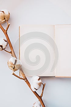 Cotton flowers and blank book