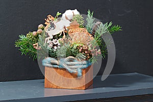 Cotton flowers and wooden reindeers in Christmas table decoration