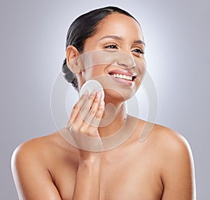 Cotton pad, beauty and woman in studio with natural, health and fresh facial treatment. Smile, skincare and female